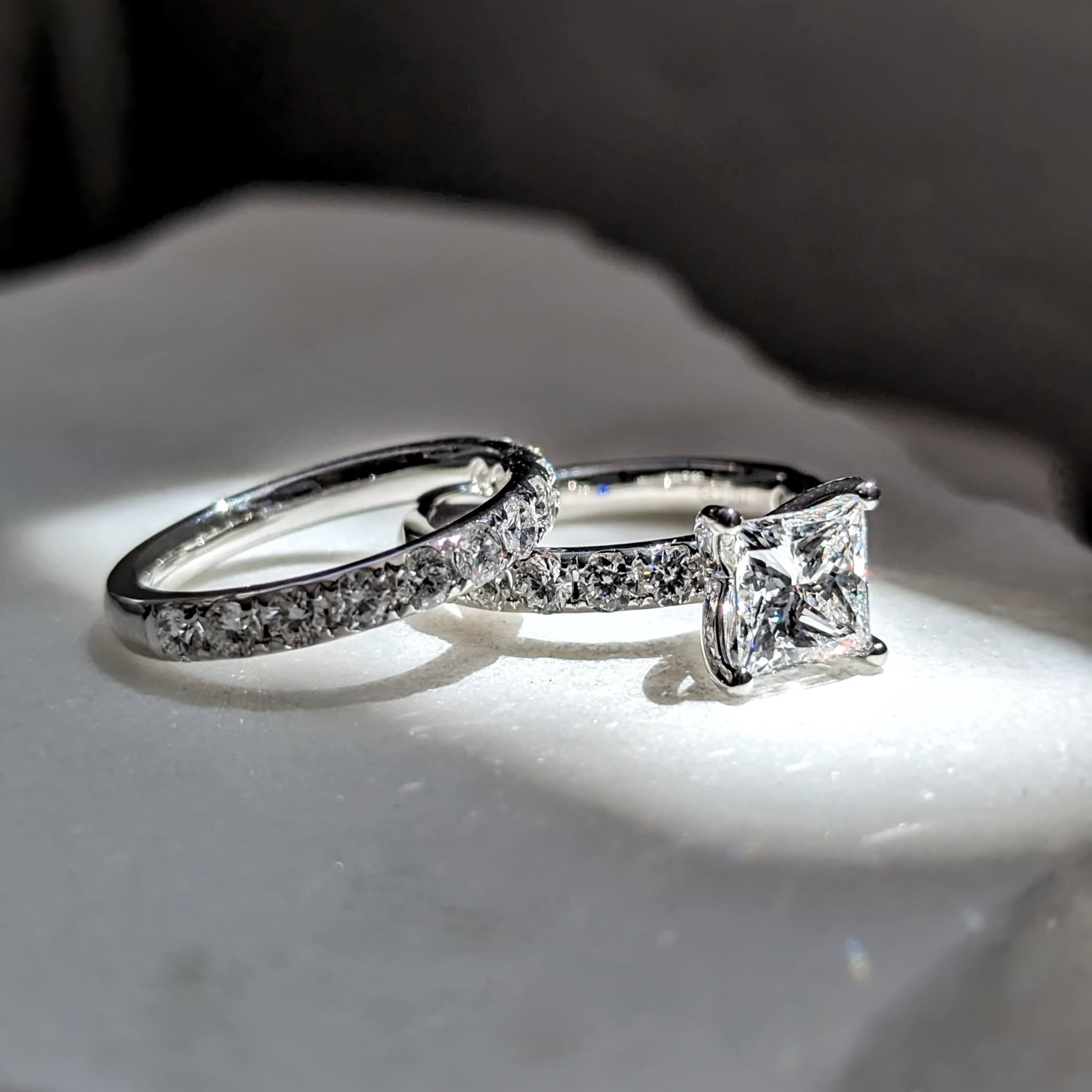 Princess cut solitaire diamond engagement ring with matching wedding ring in pave style setting